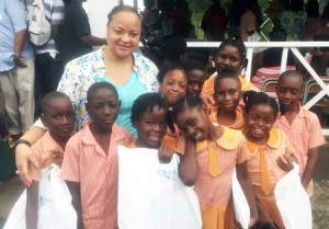Shown above is Bold City (FL) Chapter member Sylvia Perry  in Jamaica surrounded by kids from the Watford School.