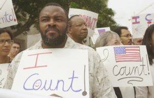 Felon Leroy Jones joins other demontsrators outside court in Miami, Wednesday, April 9, 2003, where the 11th U.S. Circuit Court of Appeals is hearing arguments on whether the state is doing enough to help ex-felons restore their voting rights. Jones finished his sentence 10 years ago. 
