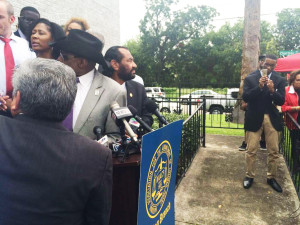 NAACP leaders square off against the protesters behind the line.