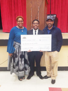 Shown above are proud parents Marsha Pratt with first place oratorical contest winner George Jr. and dad George Pratt, Sr.