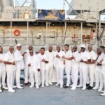Shown are the The Jacksonville Alphas in front of the USS Orleck.